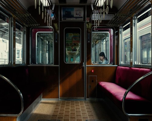 Person doing morning stretching routines near window for visual comfort